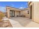 Private backyard patio with seating and access to the house at 6054 Sierra Medina Ave, Las Vegas, NV 89139