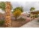 Backyard with covered patio, landscaping, and block wall at 6105 Heather Mist Ln, Las Vegas, NV 89108