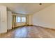 Spacious living room with tile floors and large windows at 6105 Heather Mist Ln, Las Vegas, NV 89108