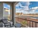 Relaxing balcony with rocking chair and city views at 6521 Taffrail Ave, Las Vegas, NV 89118