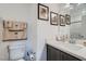 Bathroom with single vanity, toilet, and shower/tub combo at 6521 Taffrail Ave, Las Vegas, NV 89118