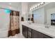 Main bathroom with double vanity and shower at 6521 Taffrail Ave, Las Vegas, NV 89118