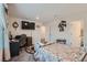 Second bedroom with a full-size bed and home office setup at 6521 Taffrail Ave, Las Vegas, NV 89118