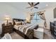 Primary bedroom suite with a decorative ceiling fan and coordinated furnishings at 6521 Taffrail Ave, Las Vegas, NV 89118