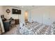 Cozy bedroom featuring neutral tones, carpet, and a dedicated workspace at 6521 Taffrail Ave, Las Vegas, NV 89118