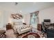 Comfortable bedroom with a queen-size bed and built-in workspace at 6521 Taffrail Ave, Las Vegas, NV 89118