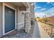 Front entrance with stone pillars and dark gray door at 6521 Taffrail Ave, Las Vegas, NV 89118