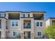 Contemporary townhome exterior boasting private balconies and modern architectural details at 6521 Taffrail Ave, Las Vegas, NV 89118