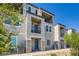 Stylish townhome featuring multi-level balconies and a well-maintained facade at 6521 Taffrail Ave, Las Vegas, NV 89118
