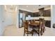 Kitchen with stainless steel appliances, a round dining table, and ample cabinet space at 6521 Taffrail Ave, Las Vegas, NV 89118