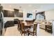 Spacious kitchen and living area featuring stainless steel appliances and a comfortable sectional sofa at 6521 Taffrail Ave, Las Vegas, NV 89118