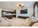 Open-concept living space with a modern kitchen, dining area, and a comfortable living room at 6521 Taffrail Ave, Las Vegas, NV 89118