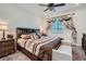 Main bedroom with king bed, large TV, and ensuite bathroom at 6521 Taffrail Ave, Las Vegas, NV 89118