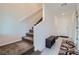 Staircase with carpeted steps leading to upper level at 6521 Taffrail Ave, Las Vegas, NV 89118