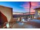 Landscaped backyard with flag, lighting, and stone pathway at 759 Shadow Reef St, Henderson, NV 89011