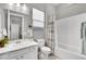 Clean bathroom with a white vanity, tub, and shower at 759 Shadow Reef St, Henderson, NV 89011