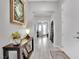 Elegant entryway with wood console table and view to the front door at 759 Shadow Reef St, Henderson, NV 89011