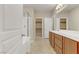 The primary bathroom has a double sink vanity and shower and tub combo at 7659 Dewy Falls Ave, Las Vegas, NV 89179