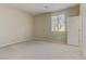 Well-lit bedroom with neutral walls and plush carpeting at 7659 Dewy Falls Ave, Las Vegas, NV 89179