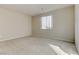 Bright bedroom with neutral walls and carpet flooring at 7659 Dewy Falls Ave, Las Vegas, NV 89179