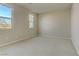 Spacious bedroom with neutral walls and carpet at 7659 Dewy Falls Ave, Las Vegas, NV 89179