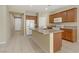 Spacious kitchen featuring a large island, granite countertops, and ample cabinet space at 7659 Dewy Falls Ave, Las Vegas, NV 89179
