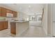 Open kitchen with granite countertops, stainless steel appliances, and tile flooring at 7659 Dewy Falls Ave, Las Vegas, NV 89179