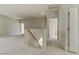A spacious upstairs loft area includes the stairway, a pony wall, and open doorways at 7659 Dewy Falls Ave, Las Vegas, NV 89179