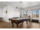 Game room with a pool table and large windows at 815 Cram Ave, Logandale, NV 89021