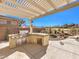 Stainless steel appliances and granite countertops highlight this outdoor kitchen at 9 Ibis Ct, Henderson, NV 89052