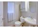 Clean and functional bathroom with white vanity and fixtures at 9009 Careful Canvas Ave, Las Vegas, NV 89149
