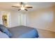 Cozy bedroom with ceiling fan and ample closet space at 9009 Careful Canvas Ave, Las Vegas, NV 89149