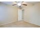 Spacious bedroom with ceiling fan and access to hallway at 9009 Careful Canvas Ave, Las Vegas, NV 89149