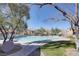 Relaxing community pool with lounge chairs at 9009 Careful Canvas Ave, Las Vegas, NV 89149