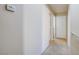 Bright hallway with carpeted floors and access to bedrooms at 9009 Careful Canvas Ave, Las Vegas, NV 89149