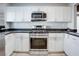 Modern kitchen with stainless steel appliances and white cabinets at 9009 Careful Canvas Ave, Las Vegas, NV 89149