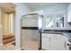 Modern kitchen with stainless steel refrigerator and white cabinets at 9009 Careful Canvas Ave, Las Vegas, NV 89149