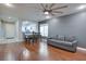 Spacious living room with hardwood floors and a ceiling fan at 9009 Careful Canvas Ave, Las Vegas, NV 89149