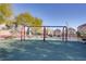 Community playground with swings at 9009 Careful Canvas Ave, Las Vegas, NV 89149