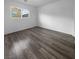 Bright bedroom featuring wood-look floors and large window at 9133 Black Beauty St, Las Vegas, NV 89113