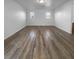 Well-lit bedroom with dual windows and wood flooring at 9133 Black Beauty St, Las Vegas, NV 89113