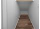 Linen closet with wood shelving and flooring at 9133 Black Beauty St, Las Vegas, NV 89113