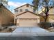 Two-story house with attached garage and landscaping at 9133 Black Beauty St, Las Vegas, NV 89113