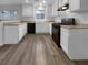 Well-lit kitchen with white cabinets and black appliances at 9133 Black Beauty St, Las Vegas, NV 89113