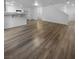 Open concept living area with grey laminate floors at 9133 Black Beauty St, Las Vegas, NV 89113