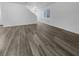 Spacious living area with grey tone laminate flooring at 9133 Black Beauty St, Las Vegas, NV 89113