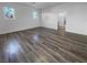 Open living area with grey tone laminate flooring at 9133 Black Beauty St, Las Vegas, NV 89113