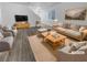 Virtually staged living room with light flooring and neutral furniture at 9133 Black Beauty St, Las Vegas, NV 89113