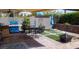 Outdoor living space with a built-in BBQ, dining area, and artificial turf at 9417 Sand Tiger Ave, Las Vegas, NV 89148