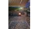 Inviting backyard at dusk with a fire pit, hot tub, and comfortable seating at 9417 Sand Tiger Ave, Las Vegas, NV 89148